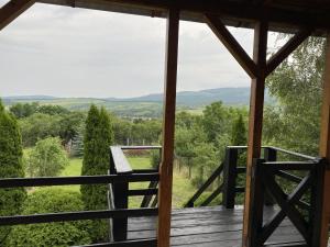 a view from the porch of a cabin with a view at Virág Apartman in Felsőtárkány