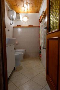 a bathroom with a toilet and a sink at Termini Loft in Rome