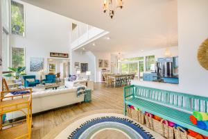 a living room with a couch and a table at Private Beachfront Lake Michigan Rental with Kayaks in Pentwater