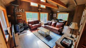 an overhead view of a living room with leather furniture at 157SL peaceful forest retreat in Franconia