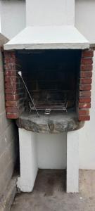 a brick oven sitting on top of a bench at A Casa de Fóra in Muros