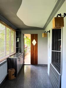 an empty room with a hallway with a door and a room with at ARTSIV Guesthouse in Dilijan +46 photos