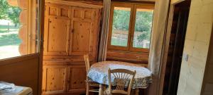 a room with a table and two chairs and a window at CHARLOTTE LA ROULOTTE in Grosbreuil +18 photos
