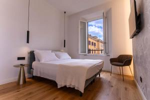 Postel nebo postele na pokoji v ubytování Scipioni Luxury Suite