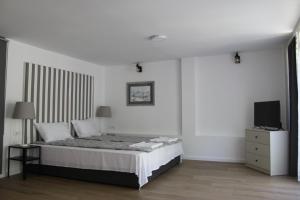 Postel nebo postele na pokoji v ubytování Apartment Sneshka