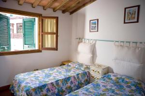 Postel nebo postele na pokoji v ubytování Hotel Barsalini