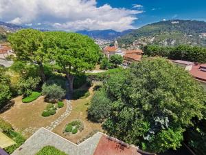 an aerial view of a park with trees and a city at Valegrand Penthouse sea view by Booking Guys in Nice