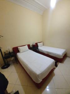 Postel nebo postele na pokoji v ubytování Hotel Achark