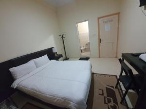 Postel nebo postele na pokoji v ubytování Hotel Achark