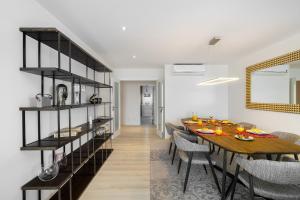 a dining room with a wooden table and chairs at Family Condo: Urban Retreat w/Parking, AC, Elevator in Great Location in Lisbon