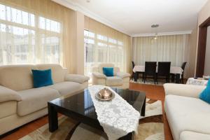 a living room with two couches and a table at Flat with Two Living Rooms and Balcony in Uskudar in Istanbul