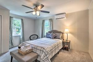 a bedroom with a bed and a ceiling fan at Spacious Family Home on Lake Marion with Boat Ramp! 