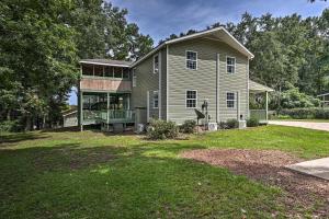 a house with a large yard in front of it at Spacious Family Home on Lake Marion with Boat Ramp! 
