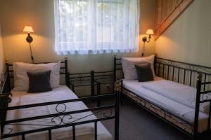 Postel nebo postele na pokoji v ubytování BurgenLandhaus