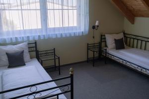 Postel nebo postele na pokoji v ubytování BurgenLandhaus