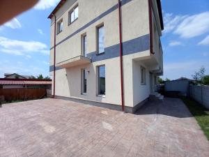a house with a brick driveway in front of it at Twins Residence 2 APART HOTEL Ap 3 2 rooms in Chiajna