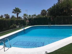 The swimming pool at or close to TAO 1 Primera línea de Playa VELILLA