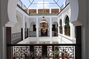 a view from the balcony of a building with a chandelier at Riad Mandana & Spa in Marrakesh