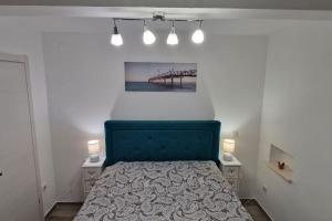 Un pat sau paturi într-o cameră la Apartments Belvedere - A4