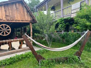 a hammock in the yard of a house at ARTSIV Guesthouse in Dilijan