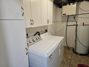 a kitchen with a white stove and a refrigerator at Douglas Lake Paradise A in Saint John