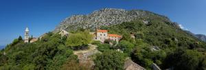 a castle on top of a mountain at Guesthouse Podaca in Podaca
