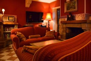 a living room with two couches and a fireplace at ColmarinoHouse 