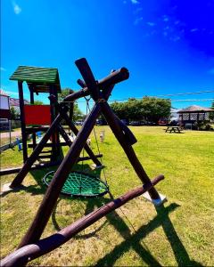 a group of baseball bats and a swing at Apartamenty Ostoja in Łeba