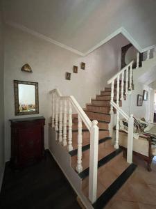 a staircase in a house with a stair case at Duplex a Sidi Bouzid in Sidi Bouzid
