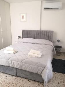 En eller flere senge i et værelse på Appartamento ERTA