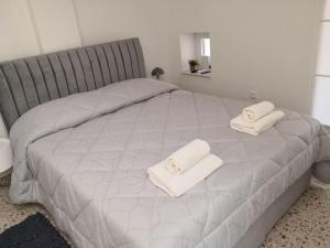 En eller flere senge i et værelse på Appartamento ERTA