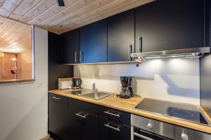 Kuchyň nebo kuchyňský kout v ubytování Superbe appartement, en 2 parties, au centre d'Anzère + 24 fotografií