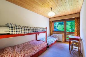 Postel nebo postele na pokoji v ubytování Superbe appartement, en 2 parties, au centre d'Anzère