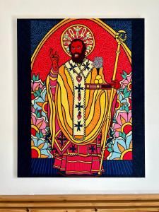 a picture of a stained glass window of a god at Santa Scolastica Home in Bari