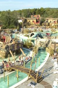 a group of people on a water slide at an amusement park at SABLE D OR in Le Grau-dʼAgde