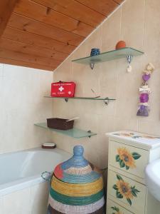 a bathroom with a tub and a toilet and a sink at La Bici Bianca in Imperia