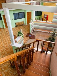 a living room with a bench and a table at Hotel Tres Flores in Huasca de Ocampo