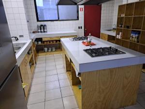 Kuchyň nebo kuchyňský kout v ubytování Hostel Cienfuegos