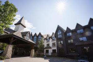 a large building with black and white at MTN House By Basecamp in Canmore