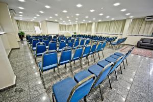 an empty room with blue chairs in a building at Hotel Dan Inn Sorocaba by Nacional Inn in Sorocaba +47 photos