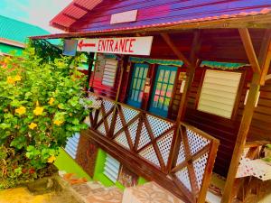 a lego house with a sign that reads entrance at Le Petit Paradis in Roseau