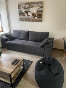 a living room with a couch and a coffee table at Chez tikaf in Saint-Claude