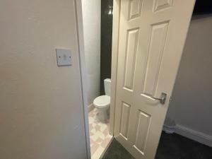 an open door to a bathroom with a toilet at South Dene Hotel in Bridlington