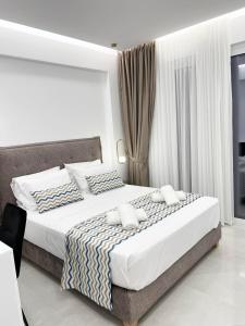 Postel nebo postele na pokoji v ubytování Oceana Suites