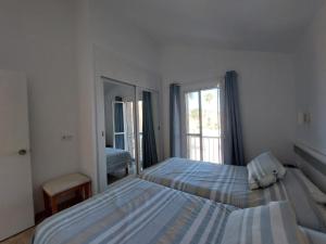 Postel nebo postele na pokoji v ubytování Bungalow FELUCIA + 16 fotografií