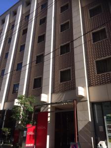 a tall building with a store in front of it at Ceeds (Adult Only) in Osaka