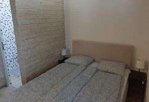 מיטה או מיטות בחדר ב-Guest House Keskic