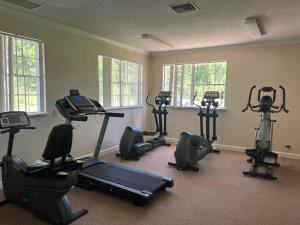 a gym with several exercise bikes in a room at Windsor Inn of Jacksonville in Jacksonville
