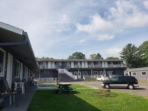 a car parked in front of a building with a picnic table at 2nd Floor, 2 Bedroom Condo, Sleeps 6 in Lake City