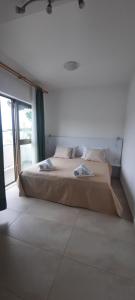 Postel nebo postele na pokoji v ubytování Apartmani Maris III
